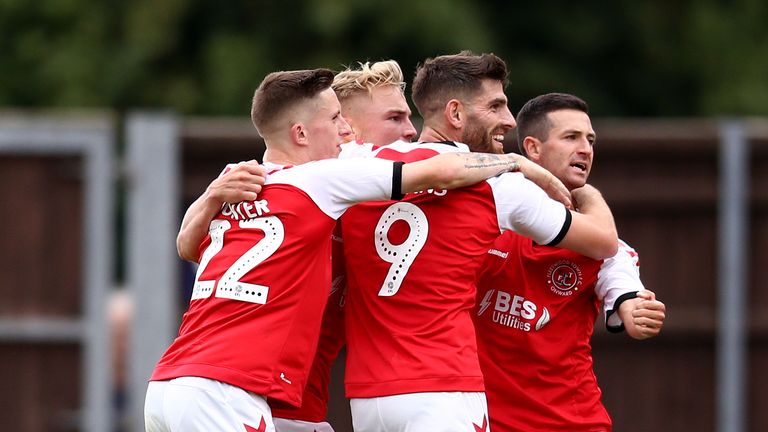 Ched Evans celebrates with  Fleetwood Town teammates