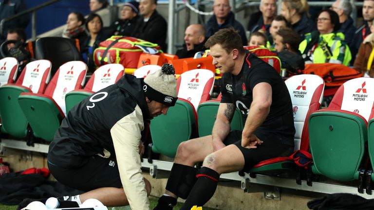Chris Ashton receives treatment during the Quilter International match between England and Japan at Twickenham