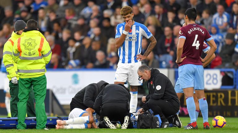 Huddersfield Town's Chris Lowe receives medical attention during the Premier League match at the John Smith's Stadium, Huddersfield. PRESS ASSOCIATION Photo. Picture date: Saturday November 10, 2018. See PA story SOCCER Huddersfield. Photo credit should read: Dave Howarth/PA Wire. RESTRICTIONS: EDITORIAL USE ONLY No use with unauthorised audio, video, data, fixture lists, club/league logos or "live" services. Online in-match use limited