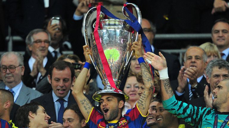 Dani Alves lifts the Champions League trophy in 2011