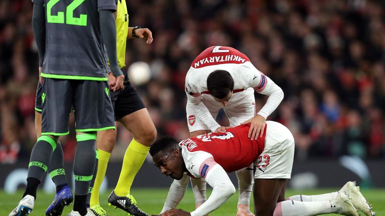 Henrikh Mkhitaryan of Arsenal stands over Danny Welbeck of Arsenal as he is injured during the UEFA Europa League Group E match between Arsenal and Sporting CP at Emirates Stadium on November 8, 2018 in London, United Kingdom. 