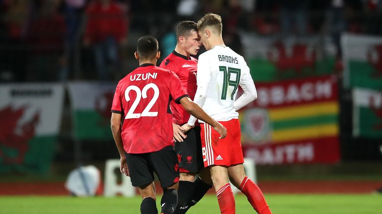 Albania's Taulant Xhaka (centre) and Wales' David Brooks (right) exchange words during the international friendly match at the Elbasan Arena. PRESS ASSOCIATION Photo. Picture date: Tuesday November 20, 2018. See PA story SOCCER Albania. Photo credit should read: Adam Davy/PA Wire. RESTRICTIONS: Editorial use only. No commercial use.