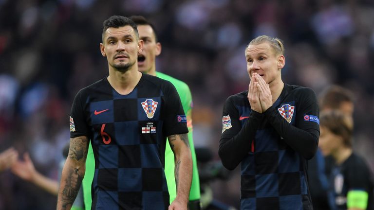 Dejan Lovren and Domagoj Vida look dejected following Croatia's 2-1 defeat to England