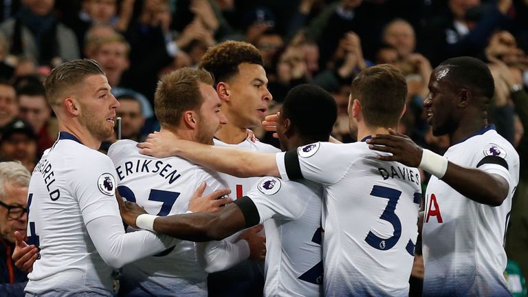 Dele Alli is congratulated by team-mates after giving Tottenham the lead