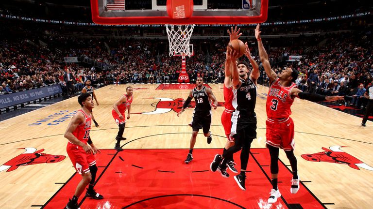 Derrick White #4 of the San Antonio Spurs shoots the ball against the Chicago Bulls on November 26, 2018 at the United Center in Chicago, Illinois.