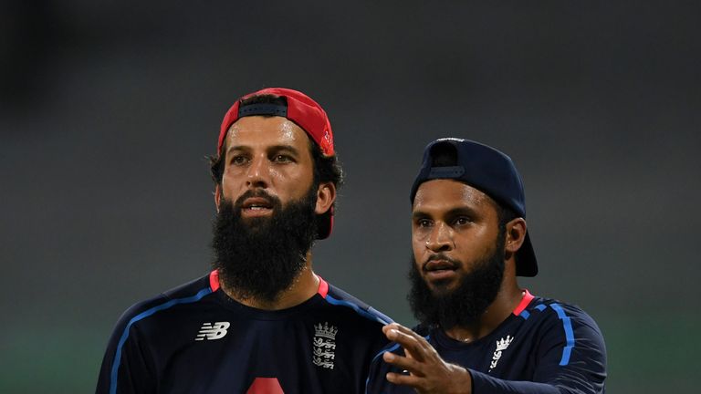 Moeen Ali (left) and Adil Rashid discuss tactics in Sri Lanka