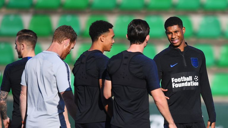 Marcus Rashford of England talks to team mates Ben Chilwell and Trent Alexander-Arnold during an England training session ahead of their UEFA Nations League match against Spain at Estadio Benito Villamarin on October 14, 2018 in Seville, Spain.