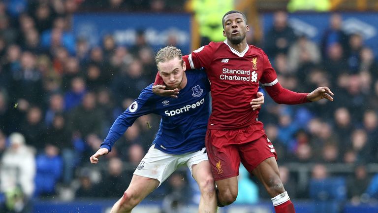 Georginio Wijnaldum and Tom Davies during the Premier League match between Everton and Liverpool at Goodison Park on April 7, 2018 in Liverpool, England.