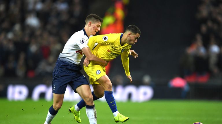 Juan Foyth challenges Eden Hazard during the match between Tottenham and Chelsea.