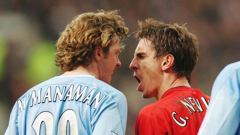 MANCHESTER, ENGLAND - FEBRUARY 14:  Gary Neville of Manchester United clashes with Steve McManaman of Manchester City during the AXA FA Cup match between Manchester United and Manchester City at Old Trafford on February 14, 2004 in Manchester, England. (Photo by John Peters/Manchester United via Getty Images)