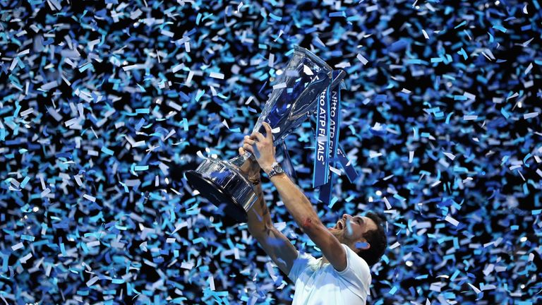 Grigor Dimitrov of Bulgaria lifts the trophy as he celebrates victory following the singles final against David Goffin of Belgium during day eight of the 2017 Nitto ATP World Tour Finals at O2 Arena on November 19, 2017 in London, England