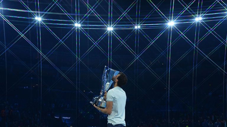 Grigor Dimitrov of Bulgaria lifts the trophy as he celebrates victory following the singles final against David Goffin of Belgium during day eight of the 2017 Nitto ATP World Tour Finals at O2 Arena on November 19, 2017 in London, England