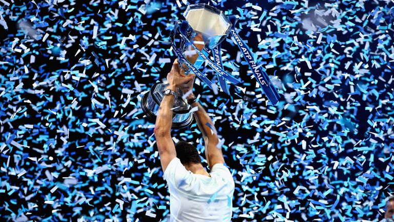 Grigor Dimitrov of Bulgaria lifts the trophy as he celebrates victory following the singles final against David Goffin of Belgium during day eight of the 2017 Nitto ATP World Tour Finals at O2 Arena on November 19, 2017 in London, England