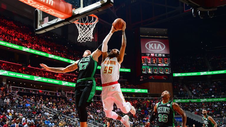 DeAndre&#39; Bembry #95 of the Atlanta Hawks shoots the ball against the Boston Celtics on November 23, 2018 at State Farm Arena in Atlanta, Georgia.