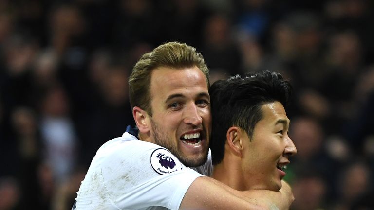 Heung-Min Son is congratulated by team-mate Harry Kane