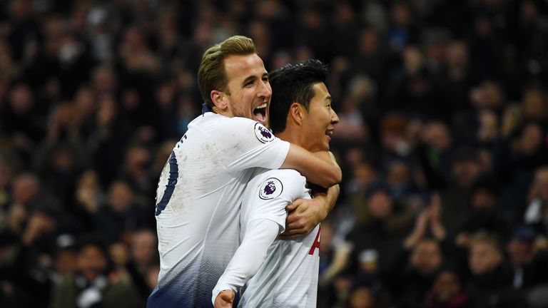 Heung-Min Son is congratulated by team-mate Harry Kane