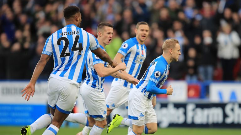 Alex Pritchard leads the Huddersfield celebrations after opening the scoring against West Ham