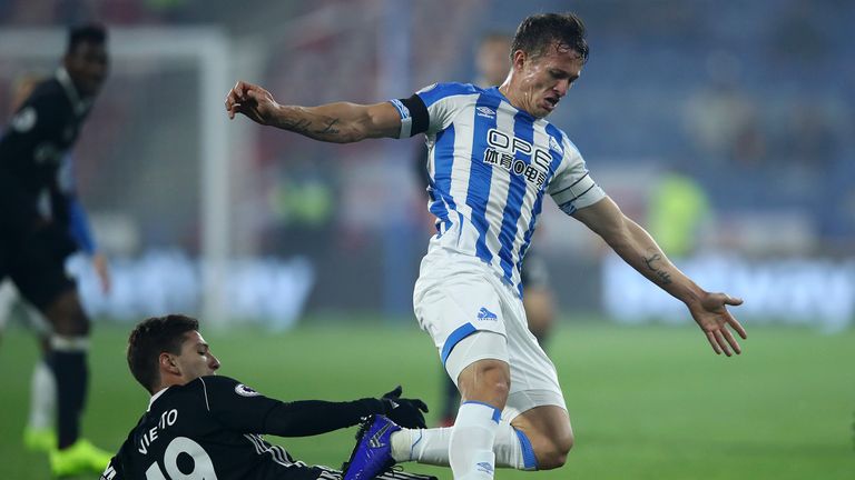 Jonathan Hogg of Huddersfield Town is tackled by Luciano Vietto of Fulham during the Premier League match between Huddersfield Town and Fulham FC at John Smith&#39;s Stadium on November 5, 2018 in Huddersfield, United Kingdom.