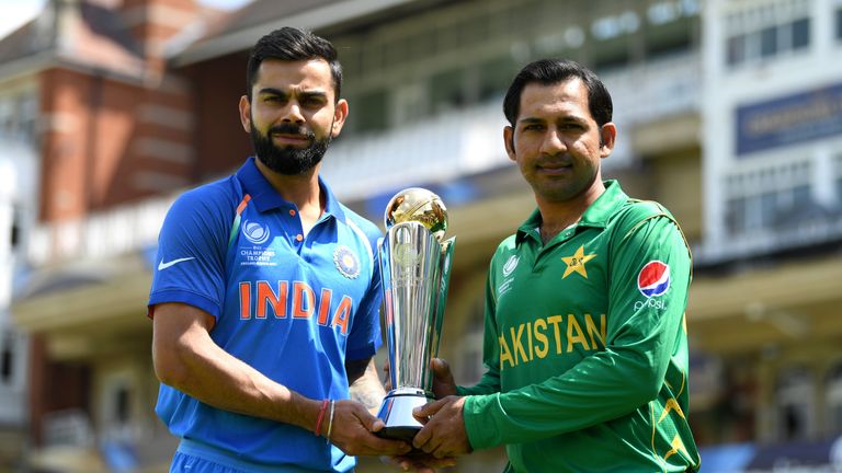 India captain Virat Kohli and Pakistan captain Sarfraz Ahmed hold the ICC Champions Trophy ahead of tomorrow's final at The Kia Oval on June 17, 2017 in London, England. 