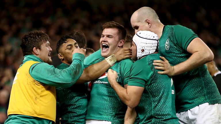 The Irish players celebrate Jacob Stockdale's try