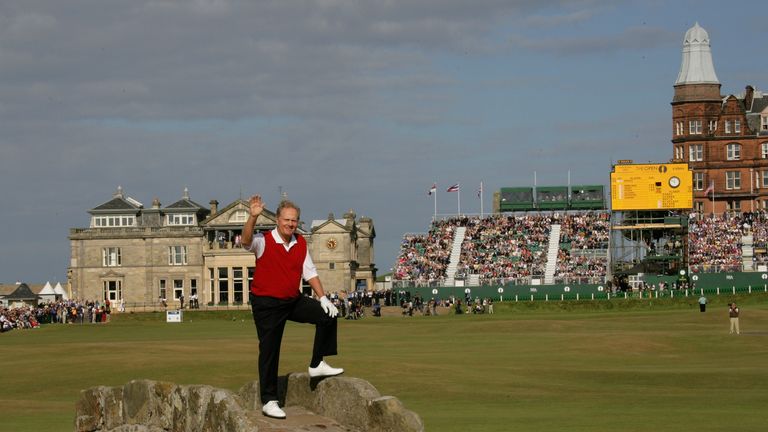 Jack Nicklaus poses for photos at the Swilcan Bridge following his second and final round at St Andrews in 2005