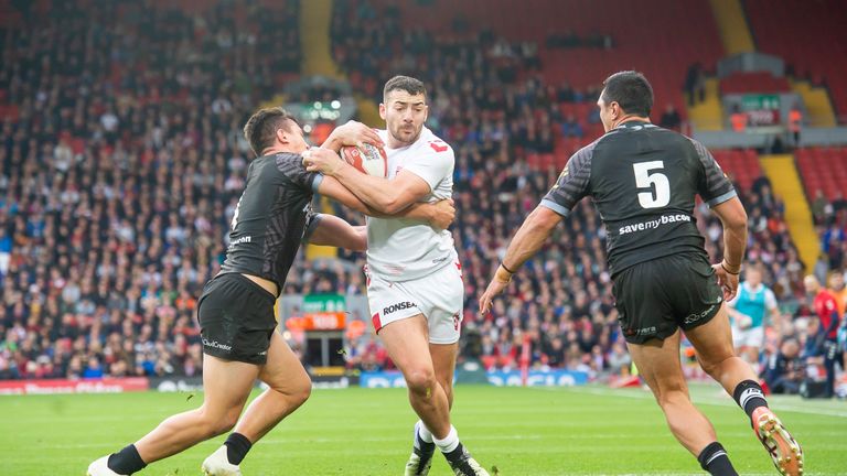 England's Jake Connor is tackled by New Zealand's Joseph Manu.