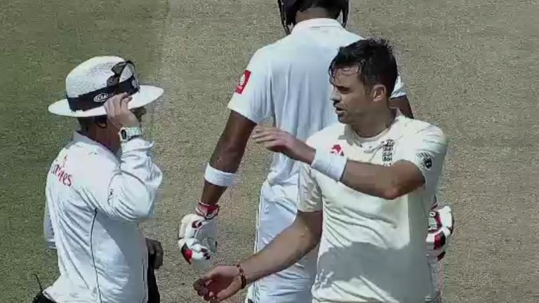 Umpire Chris Gaffaney speaks to England's James Anderson on day two of the first Test