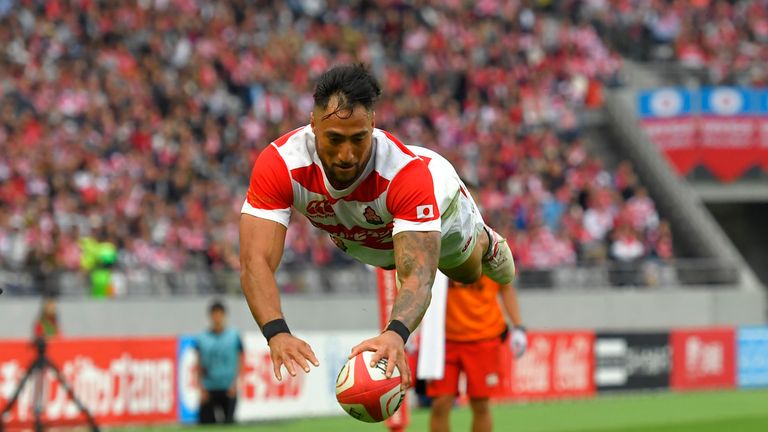 Jamie Henry dives over to score Japan's fourth try against New Zealand