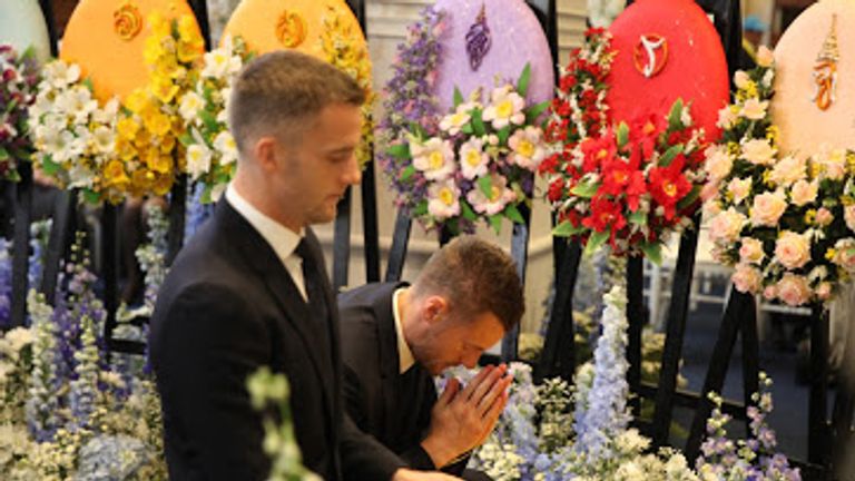 Jamie Vardy and Andy King of Leicester pay their respects at a Buddhist ceremony following the death of Vichai Srivaddhanaprabha