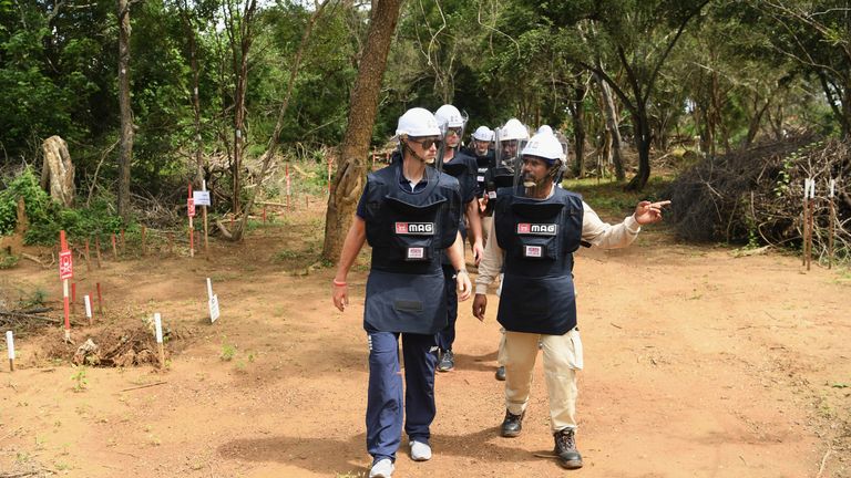 Joe Root (left) led three fellow England cricketers to visit a minefield in Sri Lanka