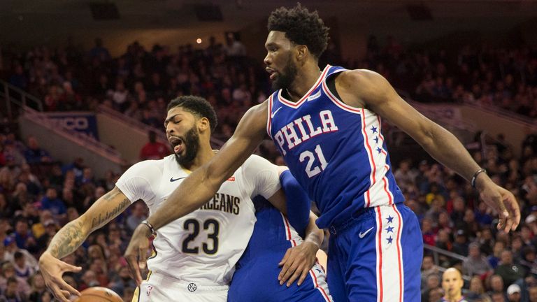 Anthony Davis #23 of the New Orleans Pelicans and Joel Embiid #21 of the Philadelphia 76ers reach for the ball in the third quarter at the Wells Fargo Center on November 21, 2018 in Philadelphia, Pennsylvania. 