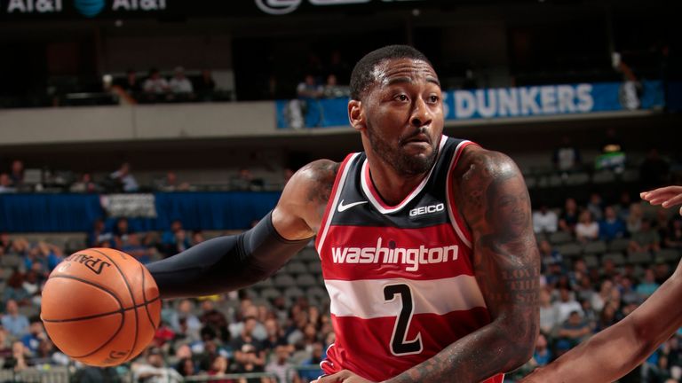 Washington Wizards guard John Wall drives inside to the basket