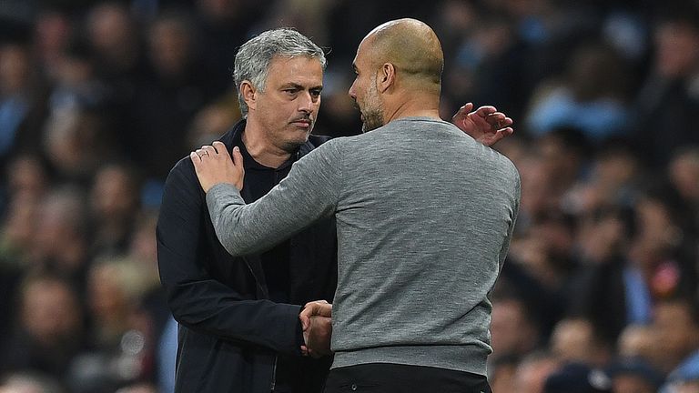 Manchester United's Portuguese manager Jose Mourinho (L) shakes hands Manchester City's Spanish manager Pep Guardiola following the English Premier League football match between Manchester City and Manchester United at the Etihad Stadium in Manchester, north west England, on April 7, 2018. 