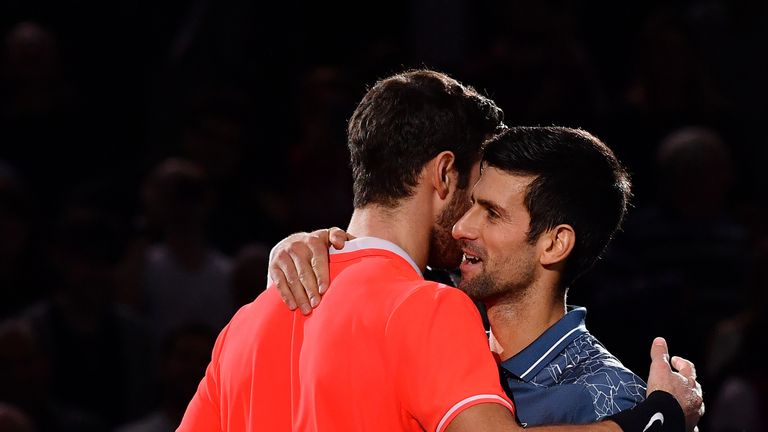 Karen Khachanov of Russia embraces Novak Djokovic of Serbia after he wins the Men's Final during Day Seven of the Rolex Paris Masters on November 4, 2018 in Paris, France. 