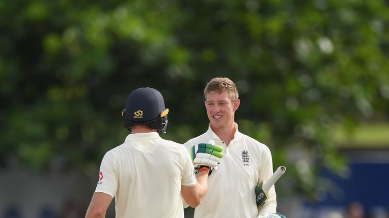 Keaton Jennings is congratulated by Jos Buttler after reaching his century