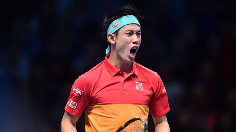 Kei Nishikori reacts after winning a point against Switzerland's Roger Federer during their singles round robin match on day one of the ATP World Tour Finals tennis tournament at the O2 Arena in London on November 11, 2018. 