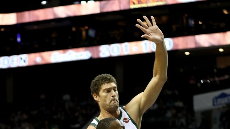 Kemba Walker #15 of the Charlotte Hornets drives to the basket against Brook Lopez #11 of the Milwaukee Bucks during their game at Spectrum Center on November 26, 2018 in Charlotte, North Carolina.