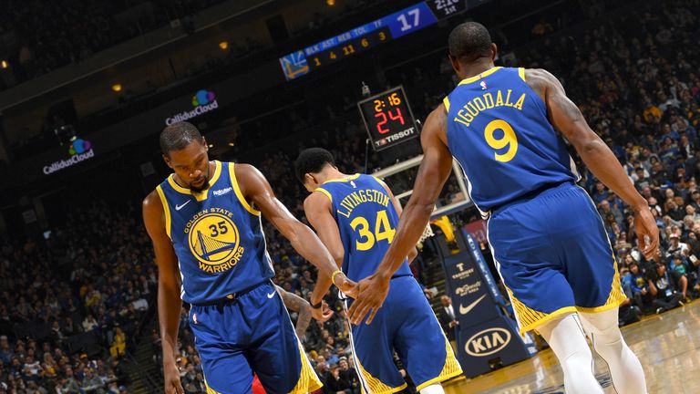 Kevin Durant shakes the hand of Andre Iguodala during Hawks @ Warriors