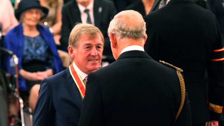 Liverpool legend Sir Kenny Dalglish is knighted by the Prince of Wales at Buckingham Palace
