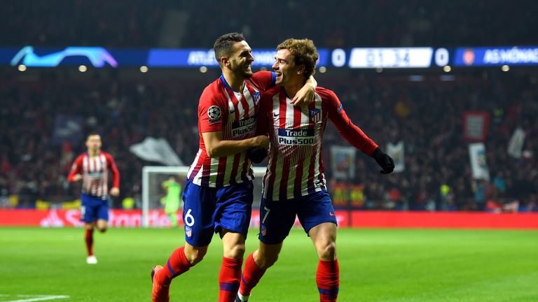 Koke celebrates his early goal with Antoine Griezmann