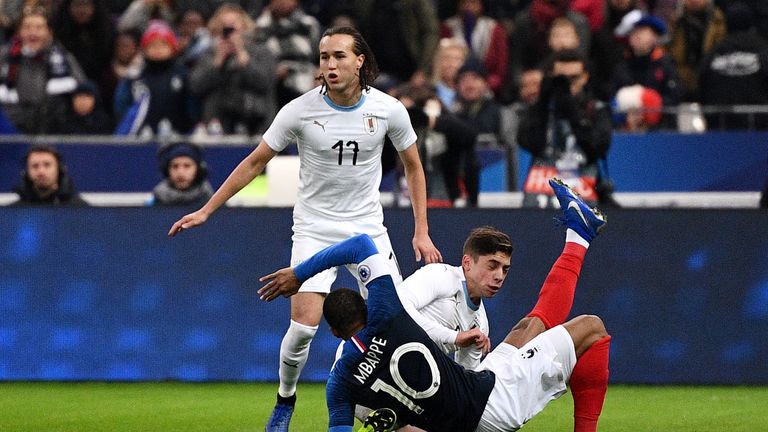 France's Kylian Mbappe falls down during the friendly football match France vs Uruguay, on November 20, 2018 at the Stade de France in Saint-Denis, outside Paris