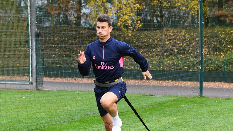 Laurent Koscielny works his way back to fitness during a training session at London Colney