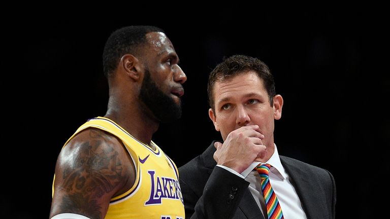 Head coach Luke Walton of the Los Angeles talks with LeBron James #23 during a pre-season basketball game against Sacramento Kingsat Staples Center on October 4, 2018 in Los Angeles, California