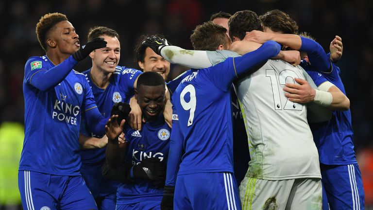 Goalkeeper Danny Ward is mobbed by his Leicester team-mates after their penalty-shoot-out win