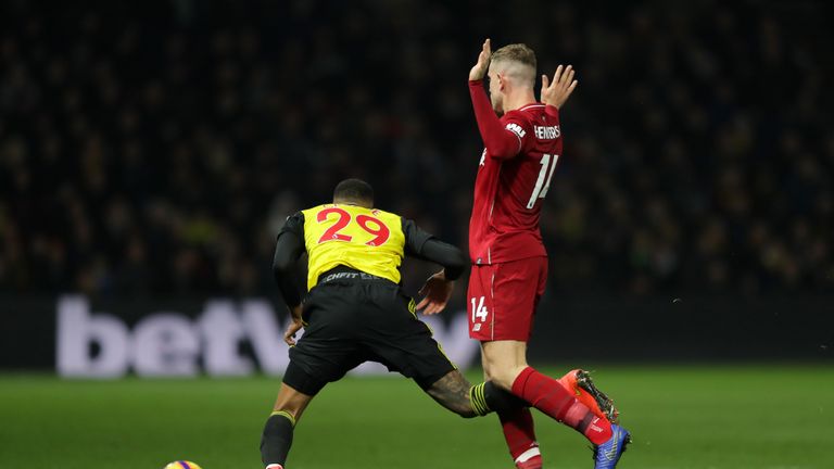  Jordan Henderson of Liverpool fouls Etienne Capoue of Watford, leading to a red card during the Premier League match between Watford FC and Liverpool FC