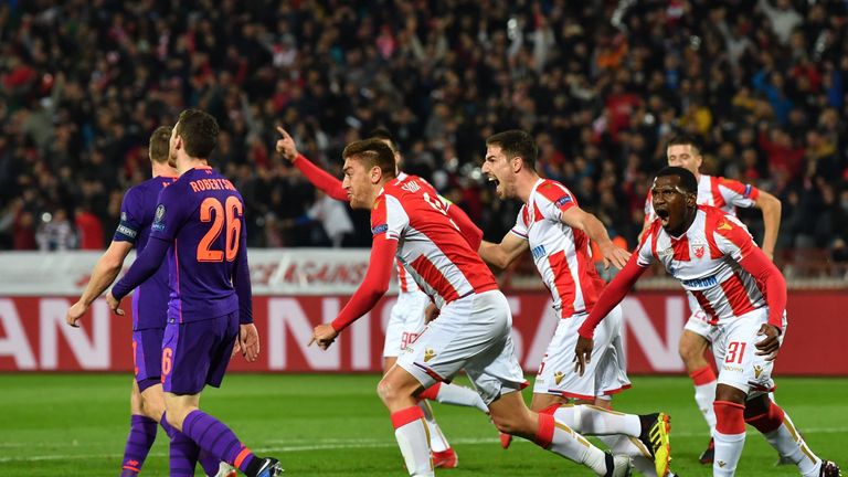Red Star Belgrade's Milan Pavkov (C) celebrates after scoring against Liverpool