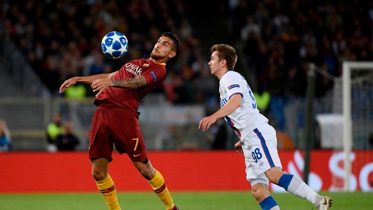 Lorenzo Pellegrini controls the ball on his chest under pressure from Ivan Oblyakov