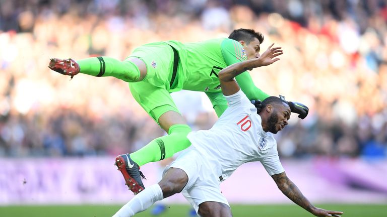 Lovre Kalinic of Croatia collides with Raheem Sterling of England during the UEFA Nations League A group four match between England and Croatia