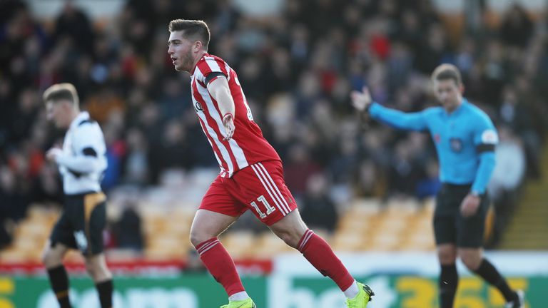 Lynden Gooch scores Sunderland's second goal in their 2-1 win over Port Vale at Vale Park.