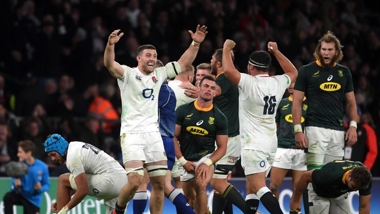 Mark Wilson (L) and Jamie George celebrate England's win over South Africa